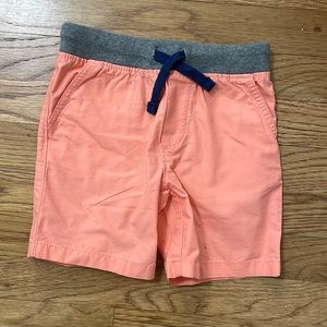 Toddler boys pull on shorts